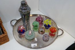 A small quantity of paperweights, silver plated tray and cocktail shaker