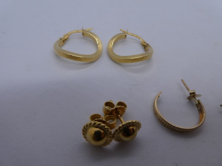 Two pairs of 9ct gold hoop earrings and a pair of 9ct gold studs, all marked, weight 3.5g approx - Image 2 of 2