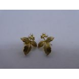 Pair of 9ct yellow gold leaf design earrings, each set with 2 seed pearls, marked 375, one back miss