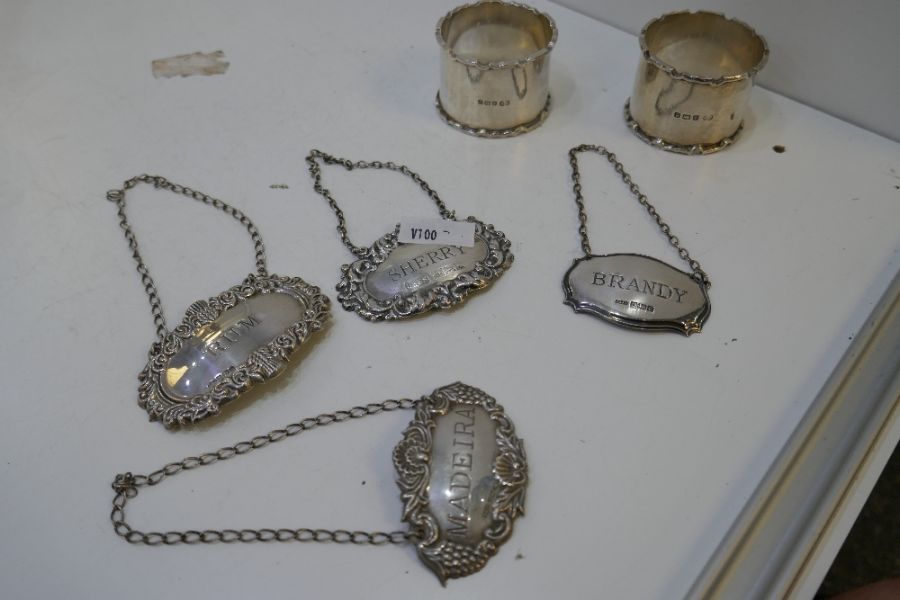 Four silver decanter labels of ornate decoration and various hallmarks and a pair of thick, silver n - Image 11 of 13