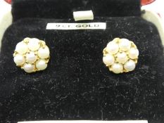 Pair of clip on 9ct yellow gold pearl set earrings, marked 9ct