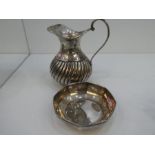 A silver jug with half reeded decoration, marked H and A  100, along with a silver Octagonal dish ma