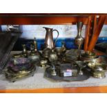 A quantity of brass and copper items to include jugs, vases, trinket boxes, etc