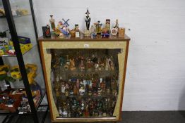 Display cabinet containing approx 300 alcohol miniatures to include a number of decorative and china