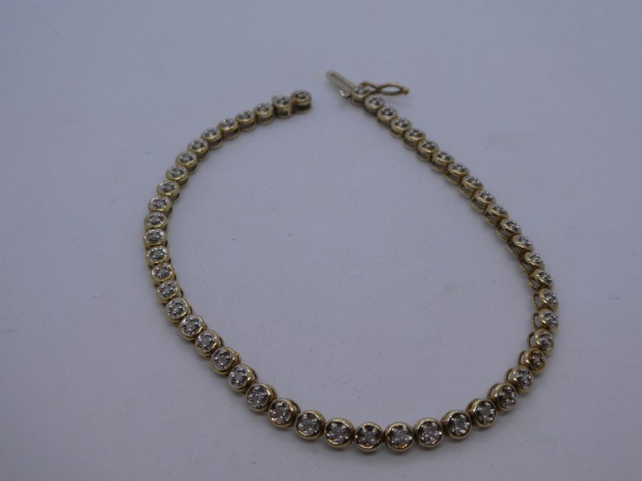 9ct yellow gold tennis bracelet, set with clear, possibly diamond chips, marked 375 on clasp, approx