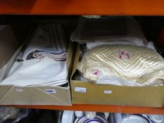 Two boxes of cross stitch linen and some lace, etc