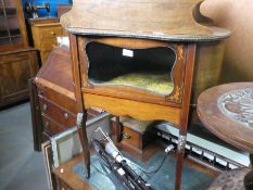 Antique mahogany kidney shaped display table, with marquetry decoration and front pacing glazed door