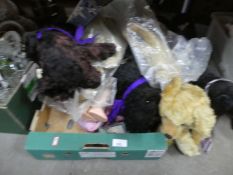 A box of well loved teddy bears and toy Scottie dogs, doll and a golly