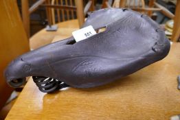 An old leather Imperial bicycle saddle, probably by Brooks, having embossed decoration