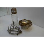 A silver lot comprising a silver bon bon dish, toast rack, napkin rings, and a silver topped cut