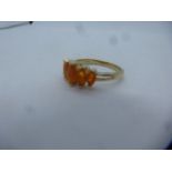 Modern 9ct yellow gold dress ring set with marquise orange stones, marked 9K, size P