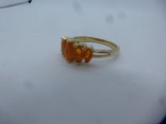 Modern 9ct yellow gold dress ring set with marquise orange stones, marked 9K, size P