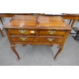 An antique 4 drawer lowboy, having mahogany cross banded drawers, 83cm