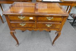 An antique 4 drawer lowboy, having mahogany cross banded drawers, 83cm