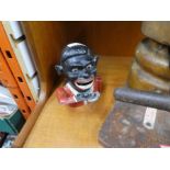 Vintage Smiling Sam money box and a vintage hat stretcher