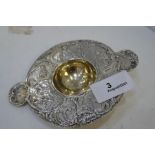 A very decorative sterling silver Dutch tea strainer, with gilded centre, having embossed people and