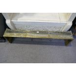 An antique brass fire kerb, probably 1920's having Oriental style decoration, 122cms