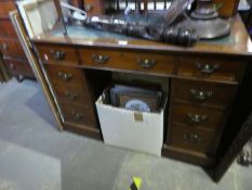 Vintage mahogany pedestal desk with spindle and brass gallery, two mini drawers, tooled leather inse