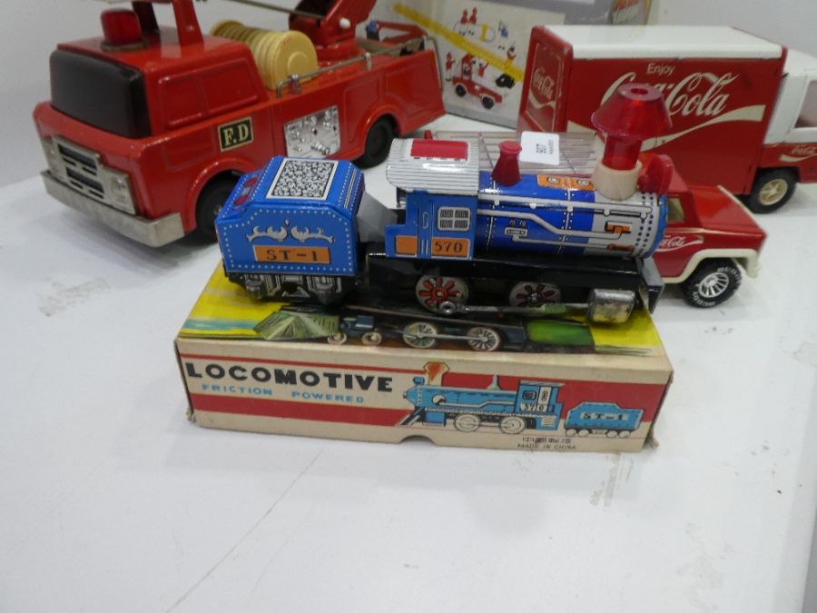 A quantity of vintage tin plate fire engines, Coca Cola trucks and train - Image 6 of 6