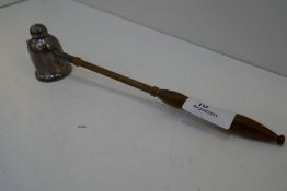 A silver candle snuffer with wooden handle, hallmarked London 1998 JA