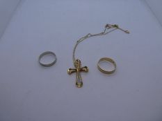 Two 9ct wedding bands, one white, one gold, size O, marked 375, 9ct yellow gold cross on chain marke