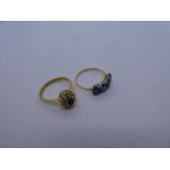 Pretty unmarked yellow metal cluster ring with central sapphire surrounded 8 round cut diamonds size