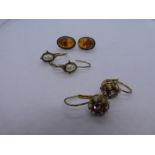 Two pairs of silver gilt earrings and a pair of silver and amber stud earrings