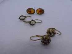 Two pairs of silver gilt earrings and a pair of silver and amber stud earrings