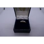 14ct yellow gold rubover set trilogy diamond ring, approx 0.9 carat - carbon visible in 2 stones, ma