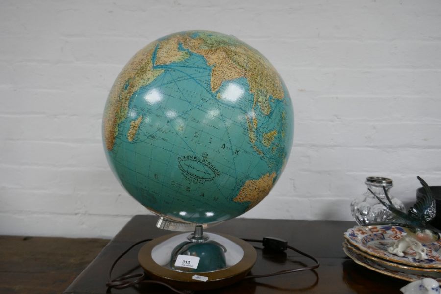 A vintage illuminated Columbus Duo Globe, made in Germany, on circular base, height 43cms