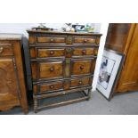 An antique oak and fruitwood Jacobean style chest having four long drawers on later stand, 102cms