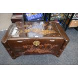 A Chinese carved camphor wood blanket box