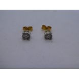 Pair of 9ct yellow gold illusion set diamond stud earrings, approx 0.15 carat each, marked 375, 1.4g