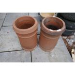 A pair of terracotta chimney pots