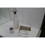 A selection of items to include a silver topped cut glass pot, a silver pusher, two silver spoons, o