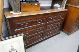 An antique oak mule chest having two drawers, 146cms