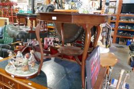 A mahogany octagonal two tier occasional table