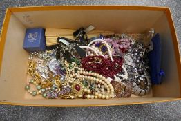 A collection of vintage costume jewellery to include bead necklaces, brooches, earrings, etc