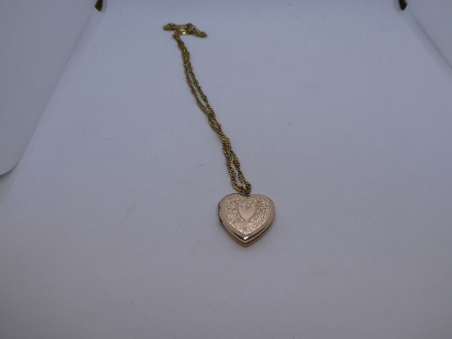 9ct yellow gold twist design neck chain, 47cm, hung with 9ct heart shaped locket pendant, 7.8g appro