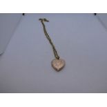 9ct yellow gold twist design neck chain, 47cm, hung with 9ct heart shaped locket pendant, 7.8g appro