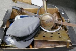Of military interest; a tray of items to include badges and a sword