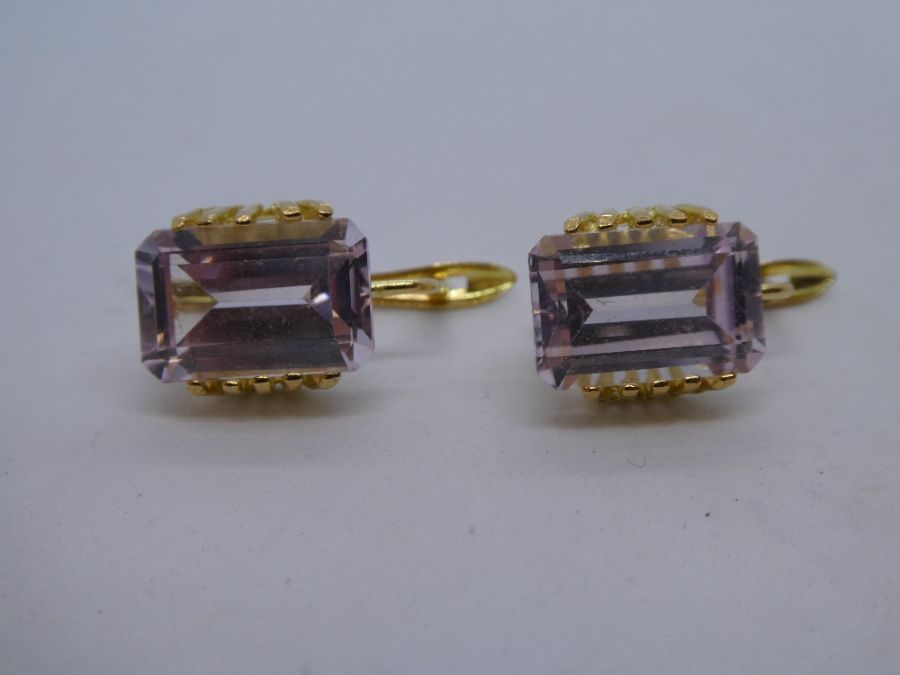 Pair of 18ct yellow gold earrings set with large baguette cut pink stones, approx 1cm, marked 750