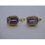 Pair of 18ct yellow gold earrings set with large baguette cut pink stones, approx 1cm, marked 750