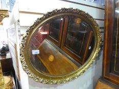Gilt frame oval bevelled wall mirror