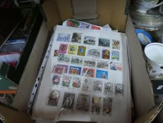 Box of mixed World stamps on pages/envelopes