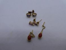 Pair of 9ct pink sapphire and diamond chip studs, blue stone pair of studs and pair of 9ct orange st