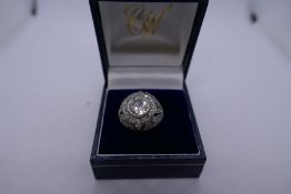 Art Deco white metal dress ring with central diamond approx 1.75 carat, and surrounded with 72 diamo