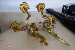 A pair of gilt metal 2 branch wall lights, having scroll decoration