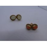 Pair of Coral inset stud earrings in 9ct yellow gold and a pair of similar white Opal examples, both