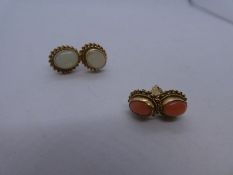Pair of Coral inset stud earrings in 9ct yellow gold and a pair of similar white Opal examples, both